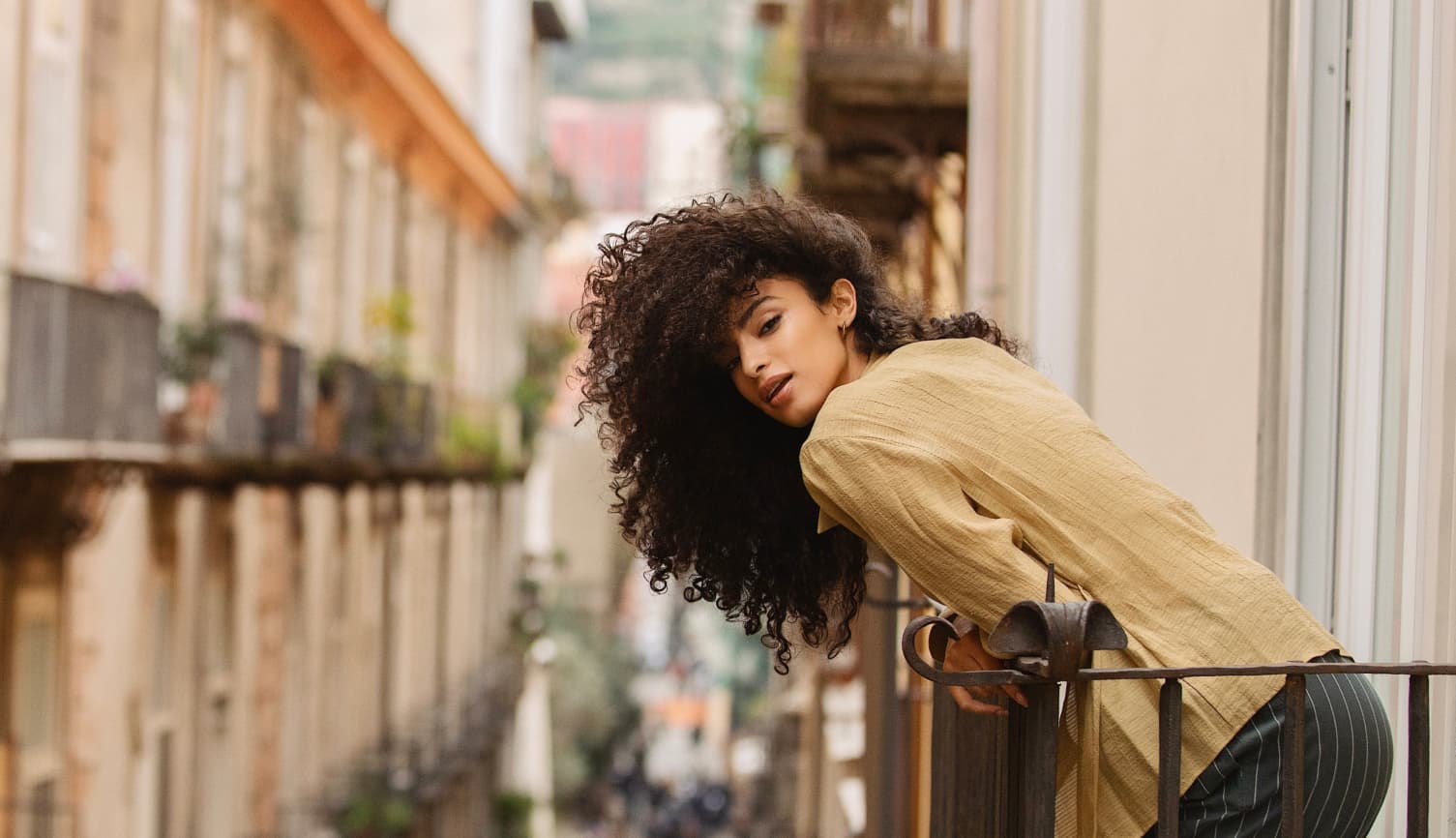 A girl on the balcony facing Spaccanapoli